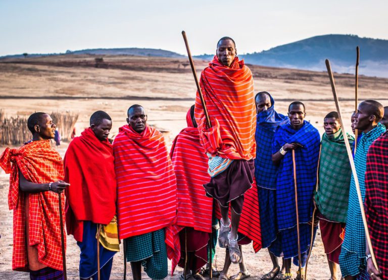 A group of people dressed in traditional attire, engaged in a captivating dance performance that portrays the cultural roots and artistic expression of a particular region. This image is used on the webpage Random Language Generator.