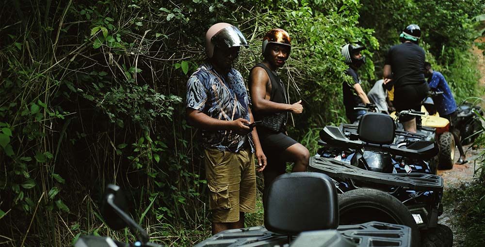 a group of people doing a Rastafari ATV Community Tour