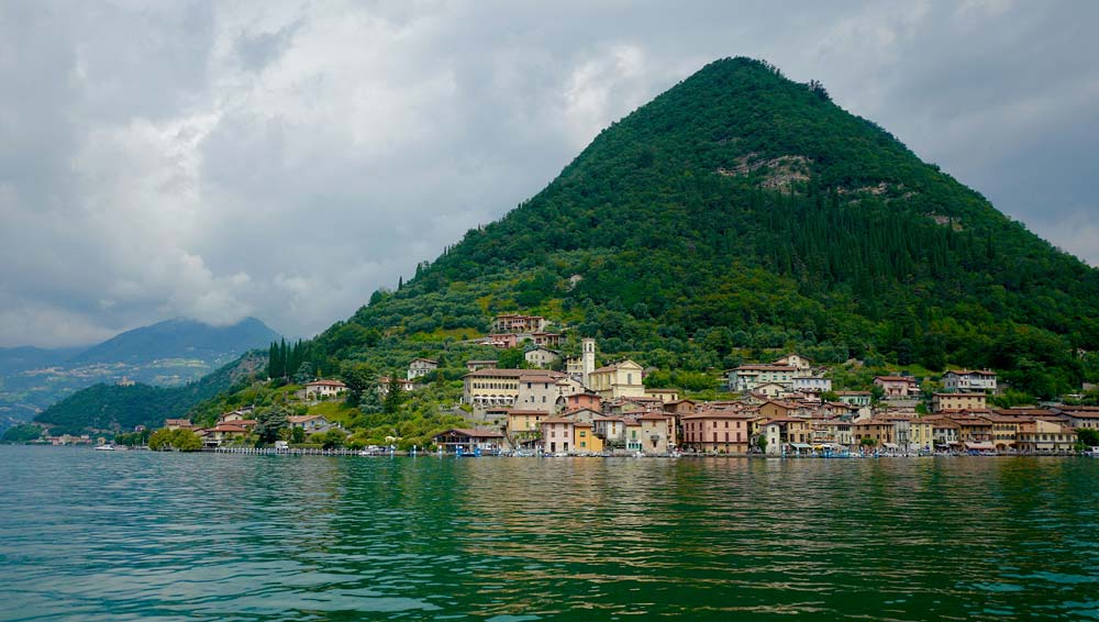 Explore the tranquil beauty of Lake Iseo in spring, a serene destination offering breathtaking views and a peaceful atmosphere.