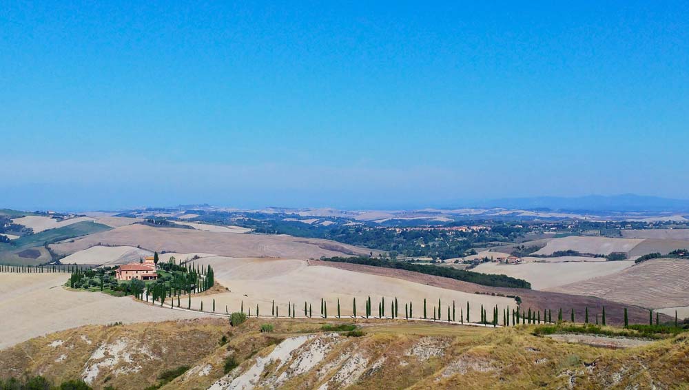 Explore Orcia Valley's springtime charm in Tuscany, a captivating blend of blooming landscapes and ancient allure for travelers seeking natural and cultural wonders.