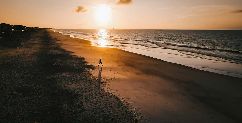 Explore the serene beauty of Topsail Beach and its golden sands.
