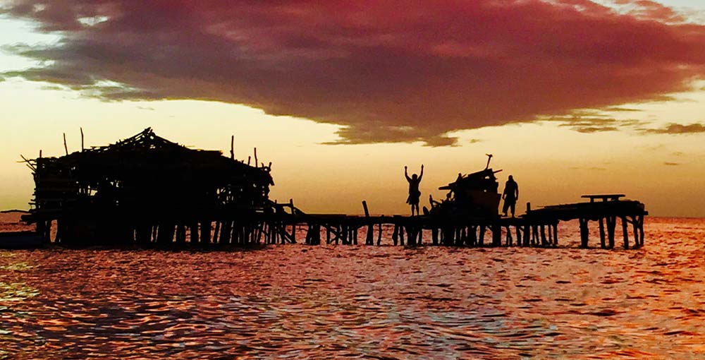 a photo of the Pelican Bar in Jamaica at sunset