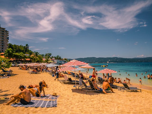 An image of a busy beach in Jamaica